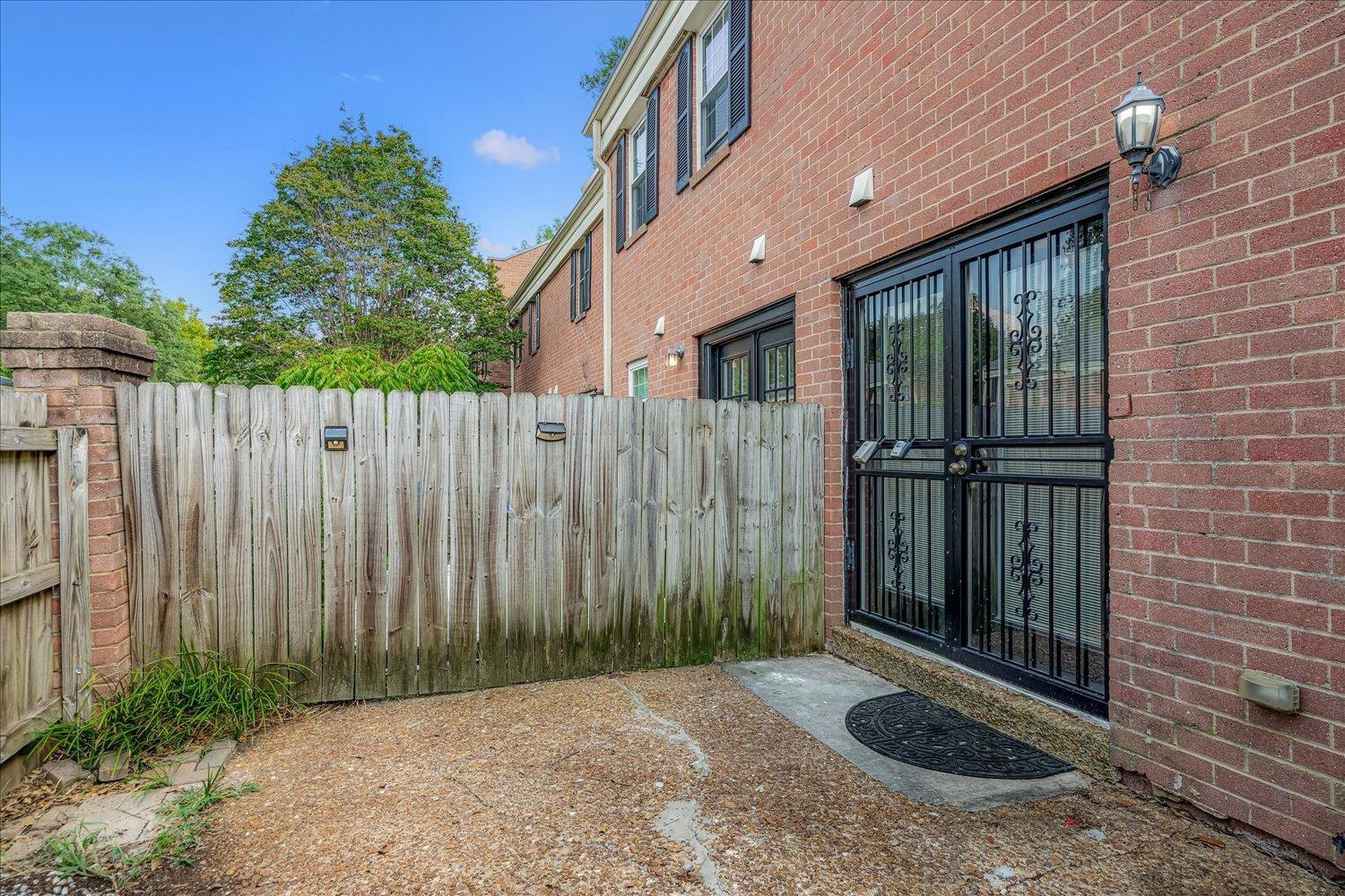 5696 Quince Road, Unit 1 Memphis, TN 38119 - Photo 18 of 26 a view of a backyard with wooden fence
