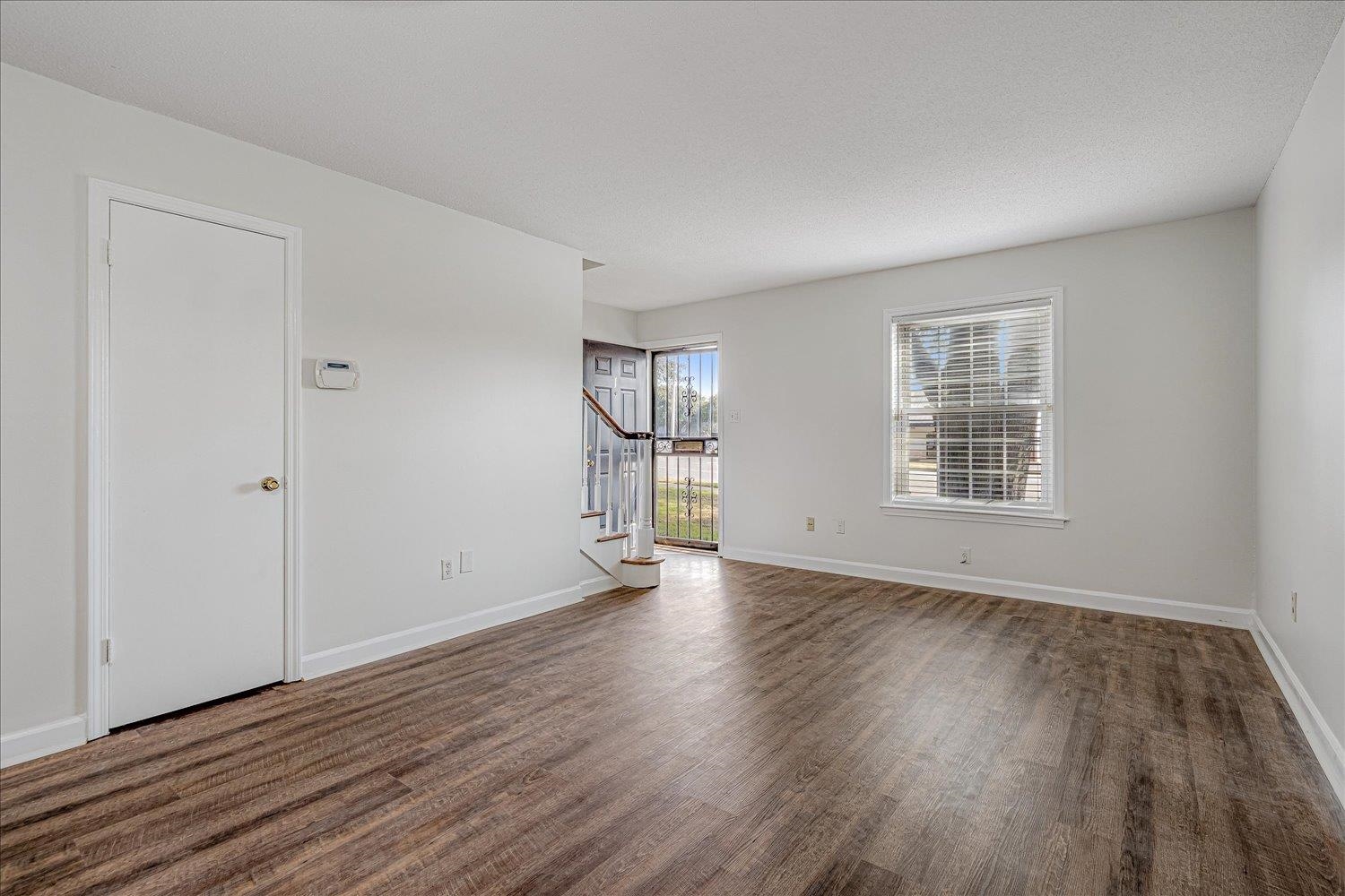 5696 Quince Road, Unit 1 Memphis, TN 38119 - Photo 26 of 26 a view of empty room with wooden floor and fan