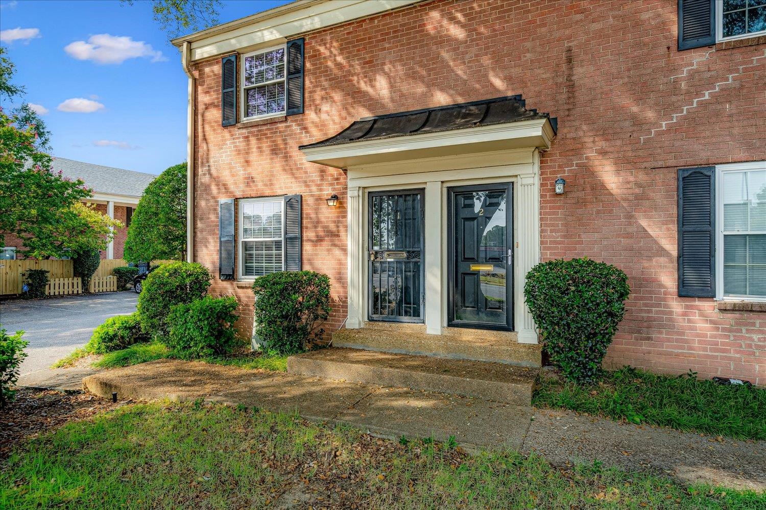 5696 Quince Road, Unit 1 Memphis, TN 38119 - Photo 7 of 26 View of exterior entry featuring brick siding