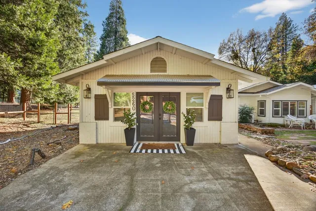 a view of a livingroom with furniture and a floor to ceiling window