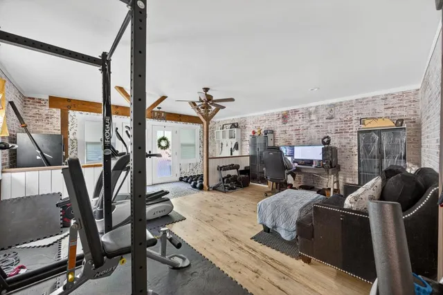 a view of a livingroom with furniture and a flat screen tv