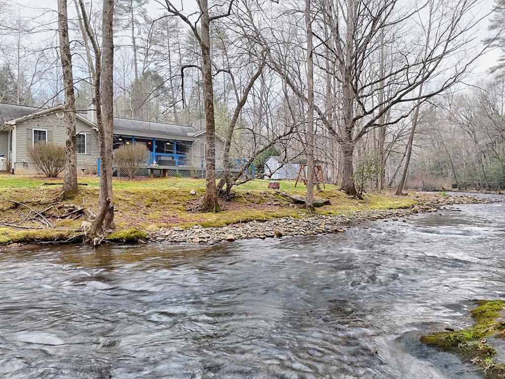 a view of a yard with snow on the road