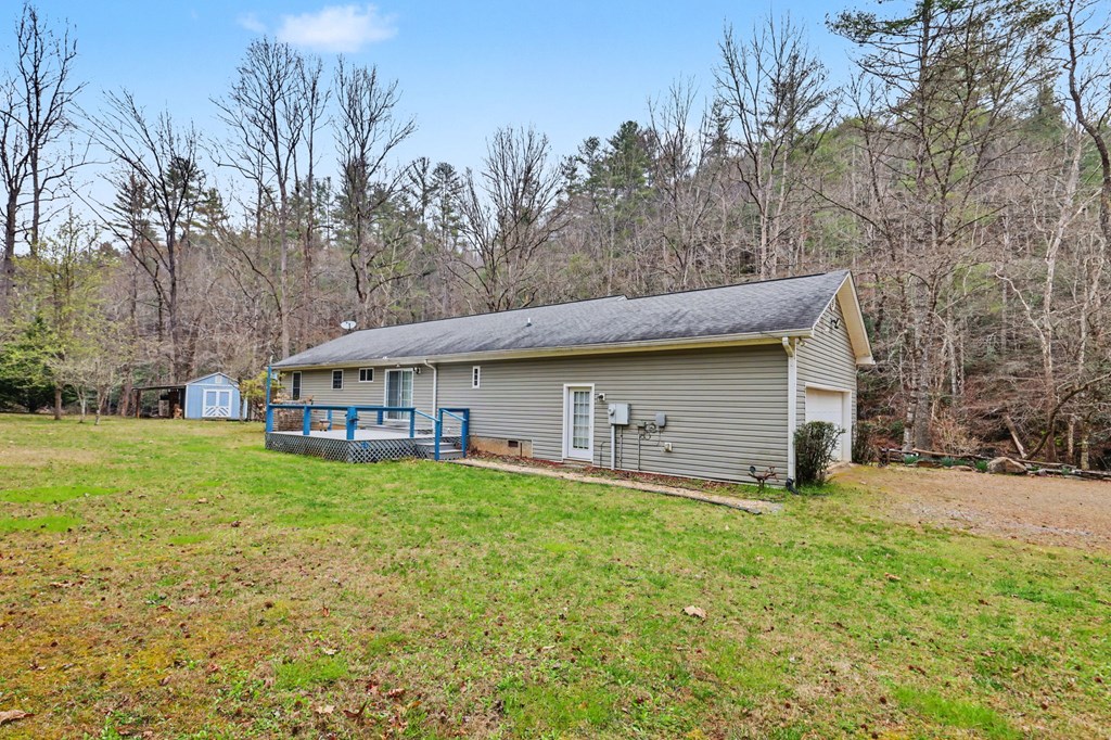 4790 Fires Creek Road Hayesville, NC 28904 - Photo 11 of 61 a backyard of a house with table and chairs