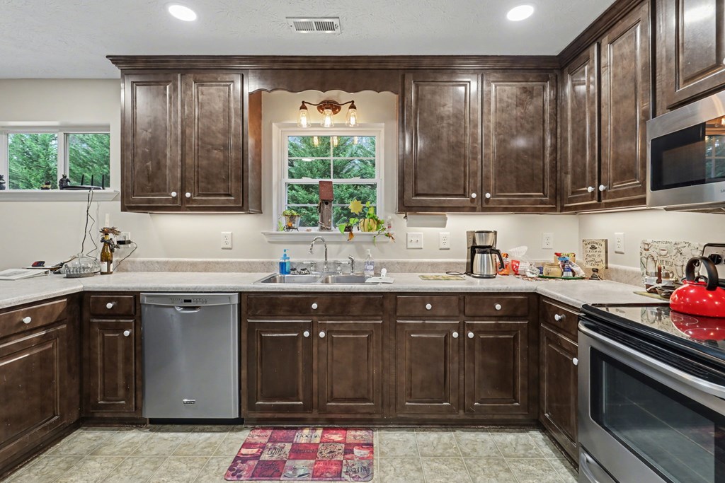 4790 Fires Creek Road Hayesville, NC 28904 - Photo 18 of 61 a kitchen with a sink stove and cabinets