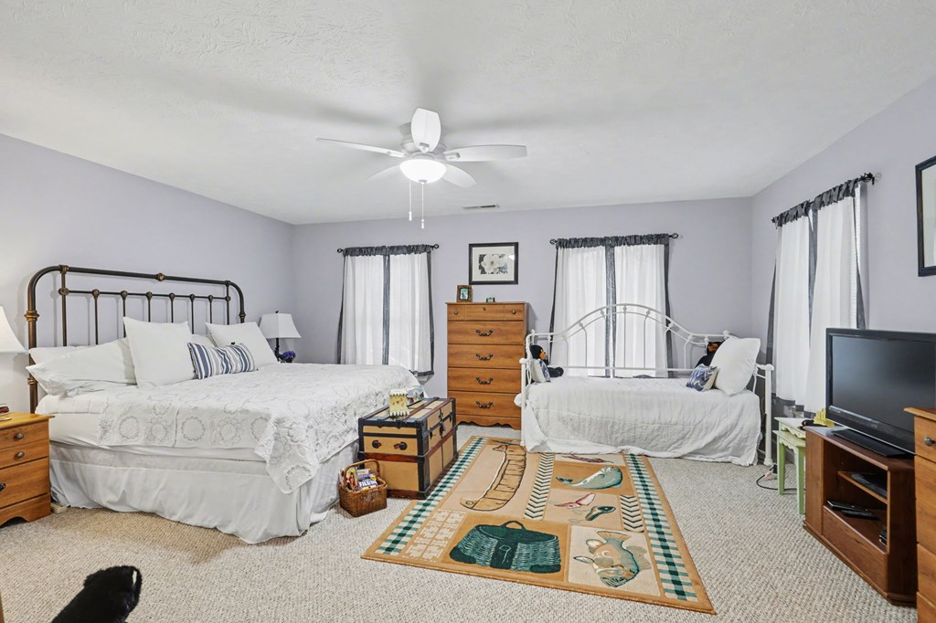 4790 Fires Creek Road Hayesville, NC 28904 - Photo 28 of 61 a bedroom with furniture and a flat screen tv