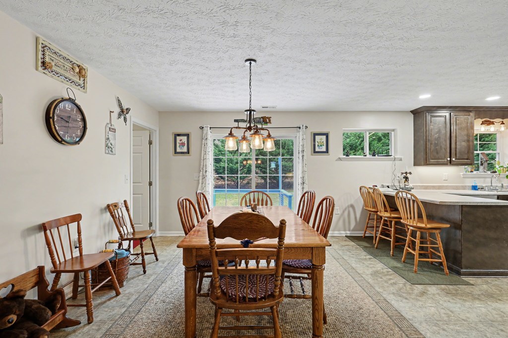 4790 Fires Creek Road Hayesville, NC 28904 - Photo 42 of 61 a view of a dining room with furniture window and outside view