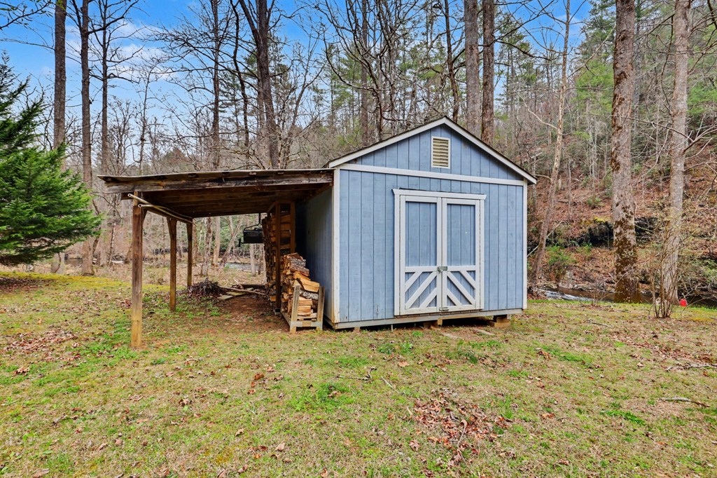 4790 Fires Creek Road Hayesville, NC 28904 - Photo 46 of 61 a view of a house with a yard