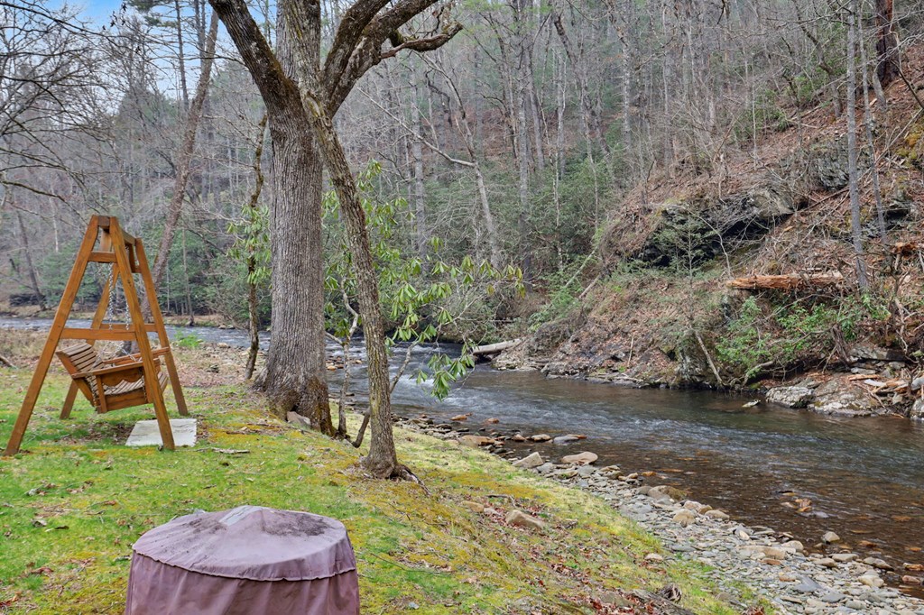 4790 Fires Creek Road Hayesville, NC 28904 - Photo 53 of 61 a view of a backyard with a barn and large trees