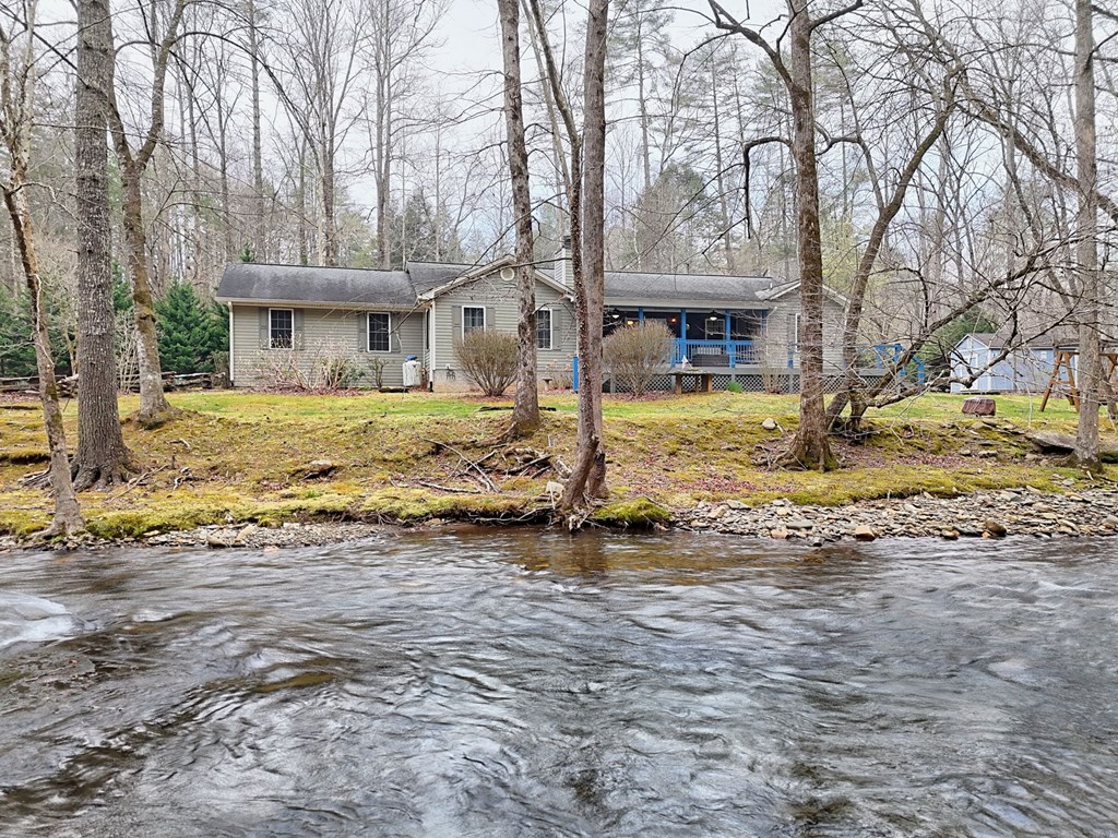 4790 Fires Creek Road Hayesville, NC 28904 - Photo 57 of 61 a front view of a house with a yard and trees