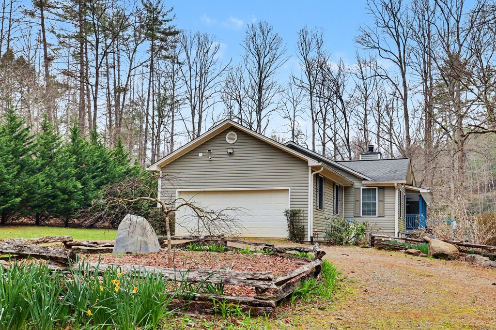 4790 Fires Creek Road Hayesville, NC 28904 - Photo 8 of 61 a front view of a house with garden