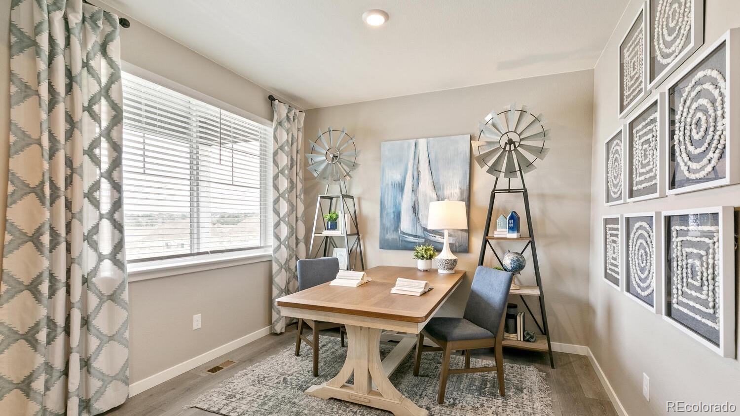 3466 Belleville Ridge Road Elizabeth, CO 80107 - Photo 12 of 24 a view of a workspace with furniture and a window