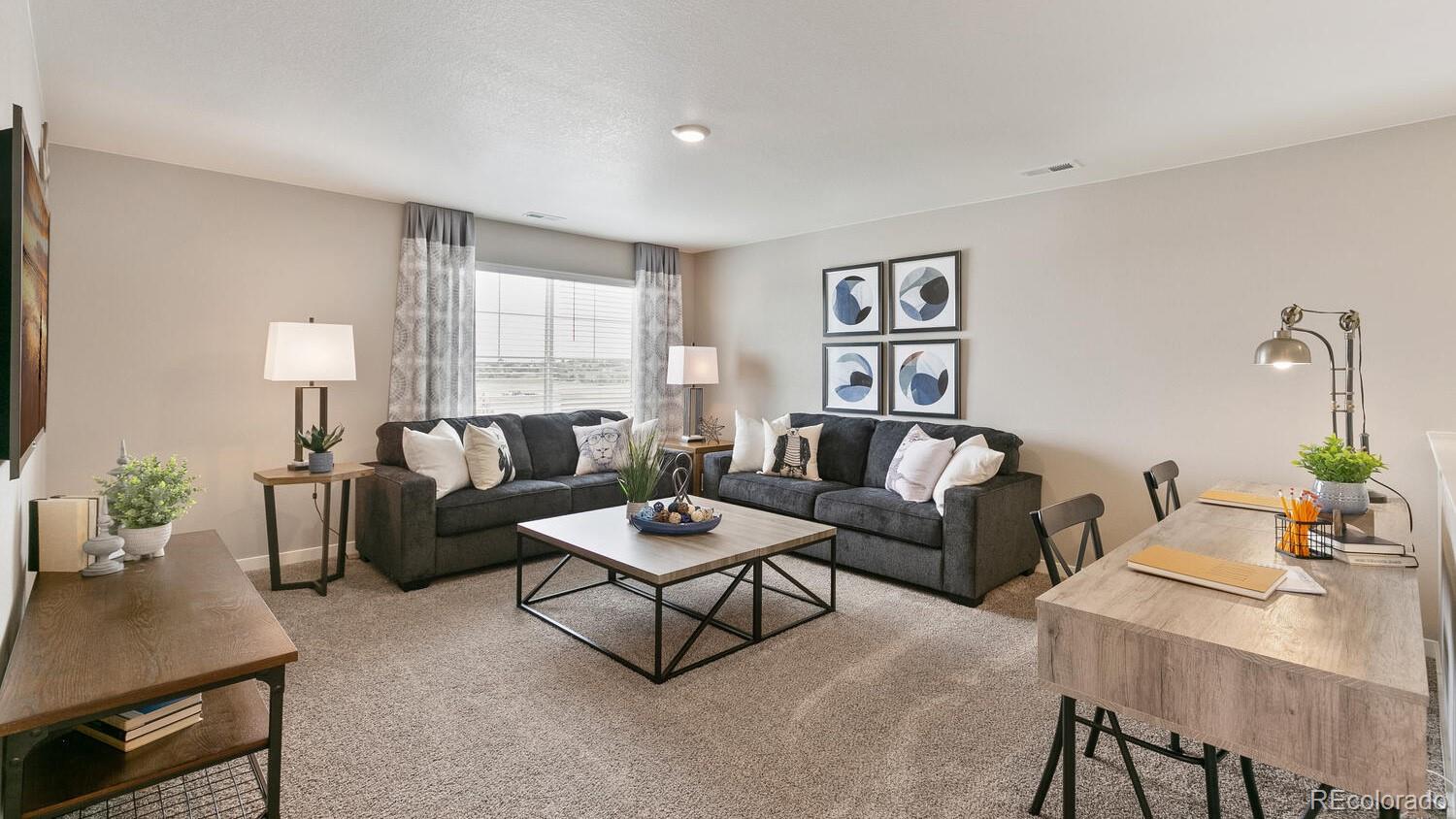 3466 Belleville Ridge Road Elizabeth, CO 80107 - Photo 14 of 24 a living room with furniture and a large window