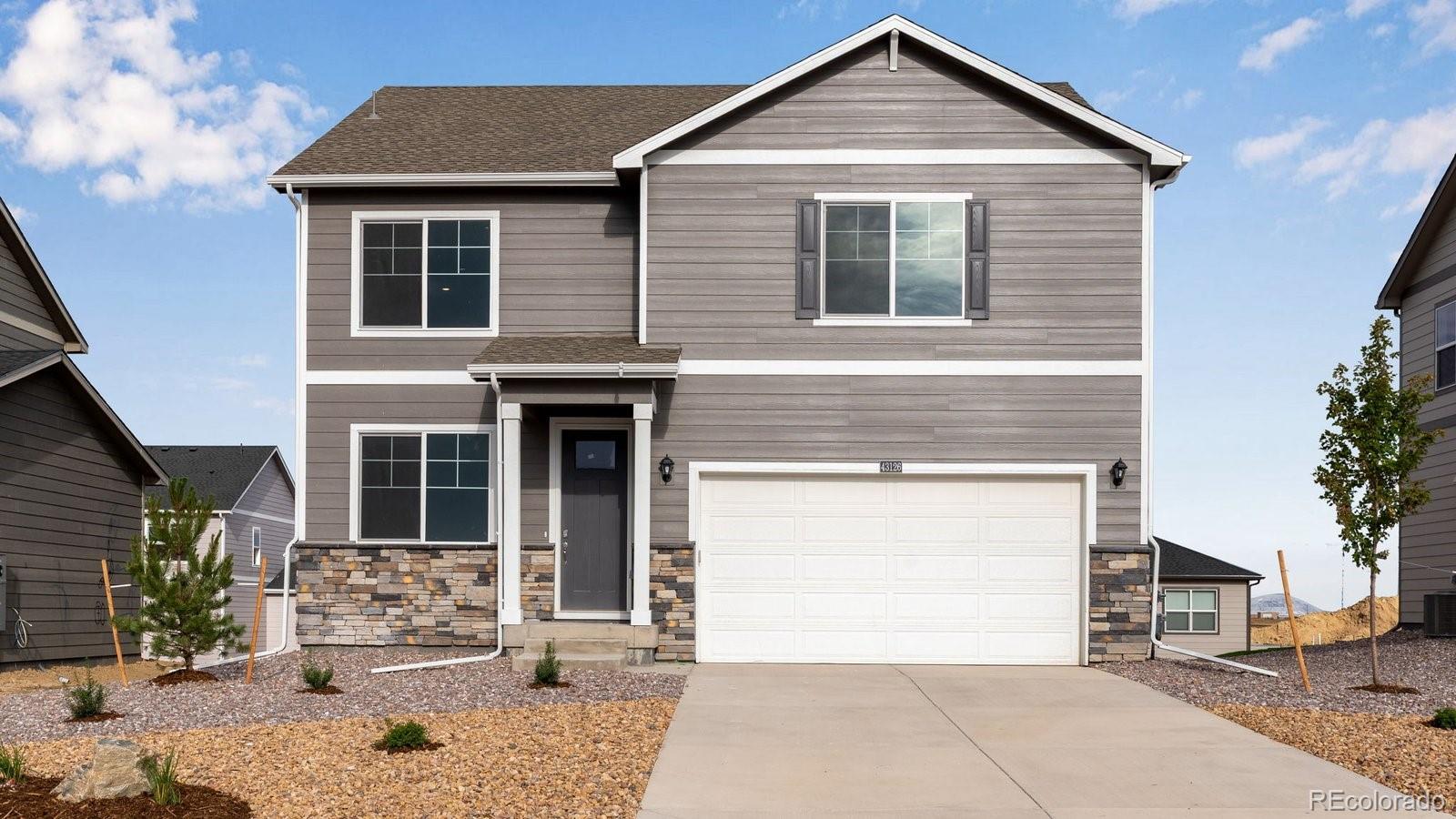 3466 Belleville Ridge Road Elizabeth, CO 80107 - Photo 2 of 24 a front view of a house with a yard