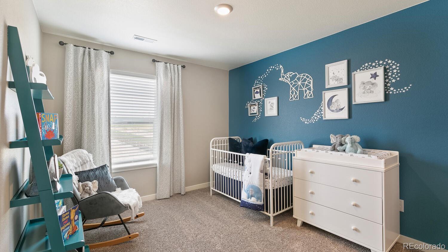 3466 Belleville Ridge Road Elizabeth, CO 80107 - Photo 22 of 24 a living room with furniture and a window