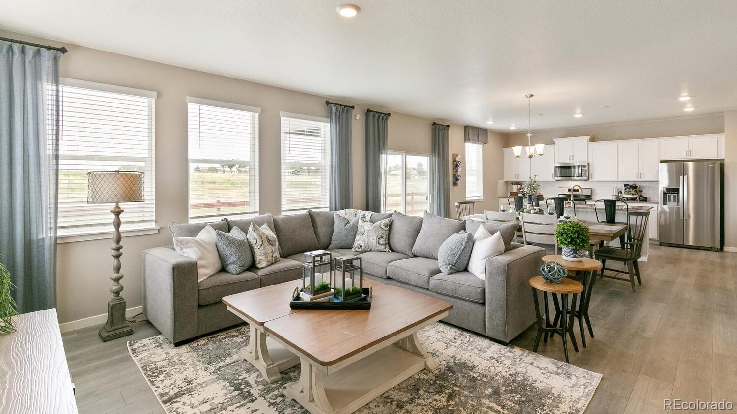 3466 Belleville Ridge Road Elizabeth, CO 80107 - Photo 4 of 24 a living room with furniture wooden floor and a table