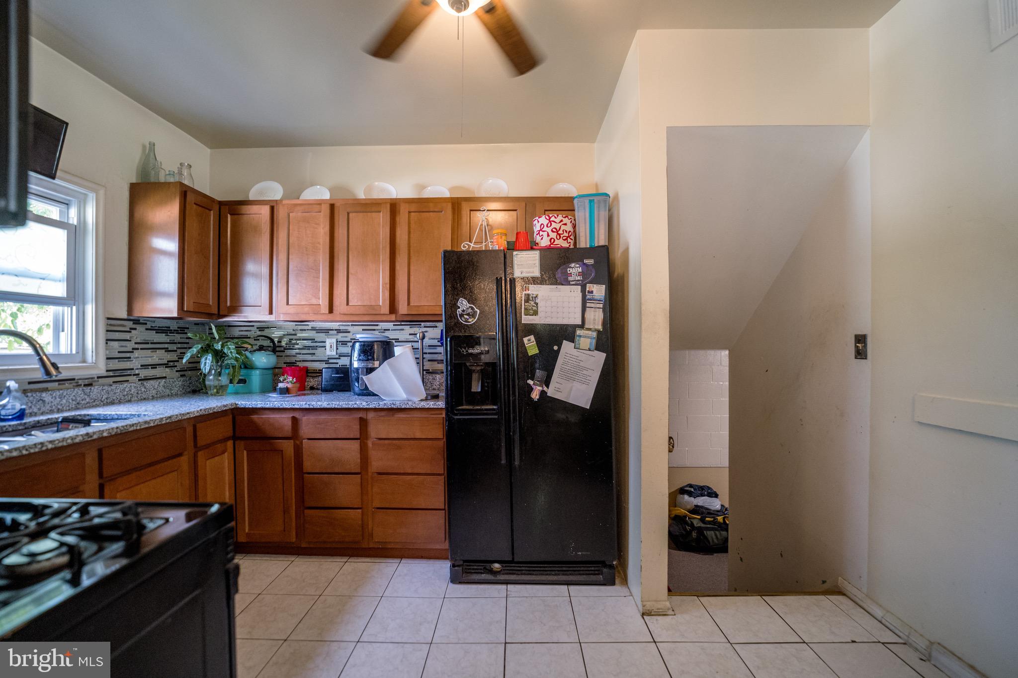 4125 Ronis Road Pikesville, MD 21208 - Photo 29 of 40 a kitchen with a refrigerator and window