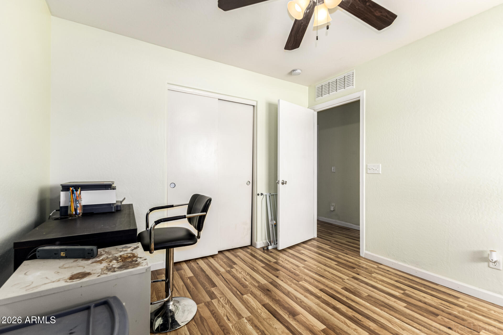 40264 West Lococo Street Maricopa, AZ 85138 - Photo 12 of 29 a bedroom with furniture and a ceiling fan