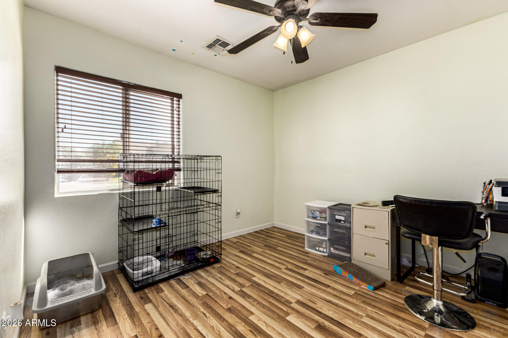 40264 West Lococo Street Maricopa, AZ 85138 - Photo 13 of 29 a view of a workspace with furniture and a window