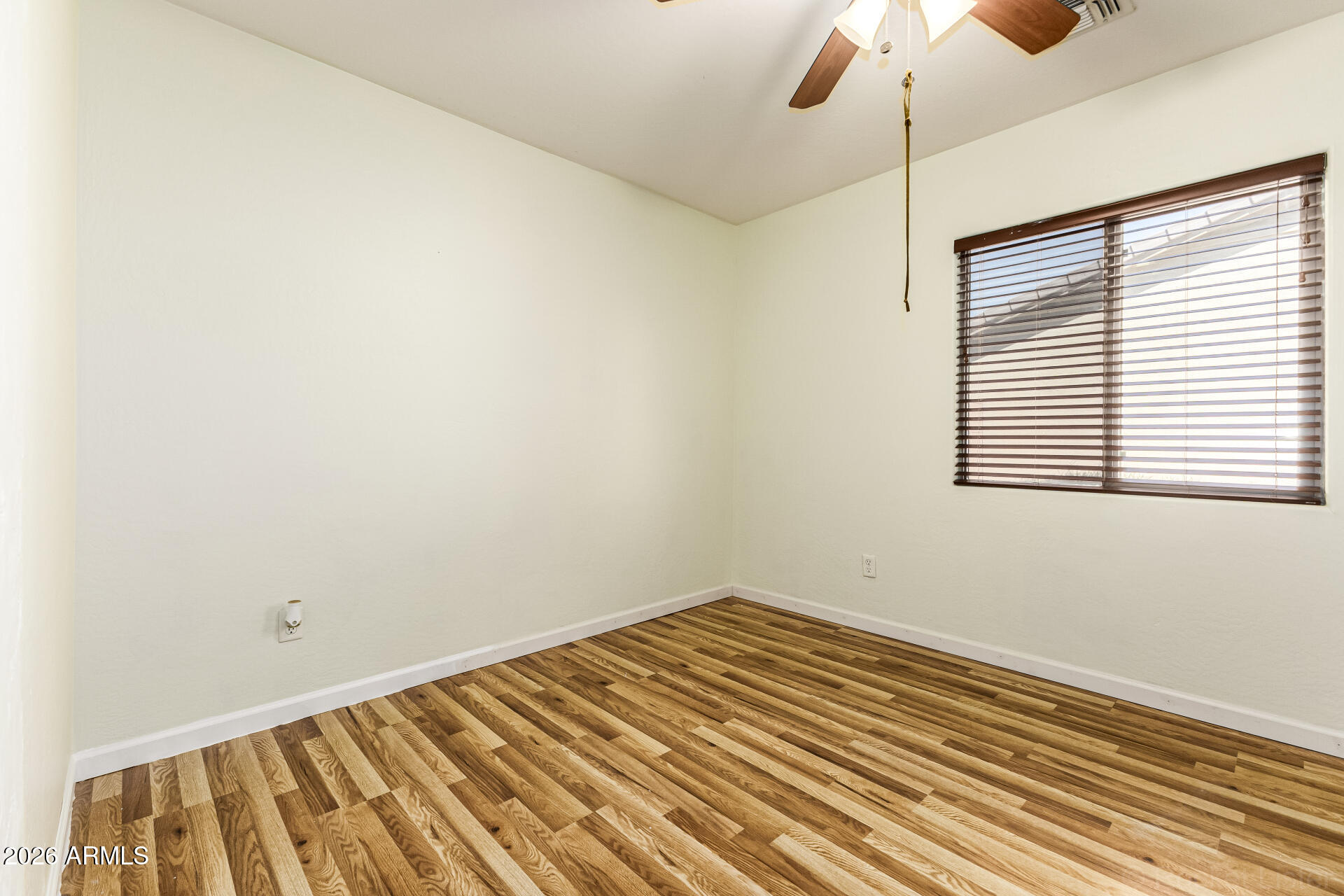 40264 West Lococo Street Maricopa, AZ 85138 - Photo 15 of 29 an empty room with a window