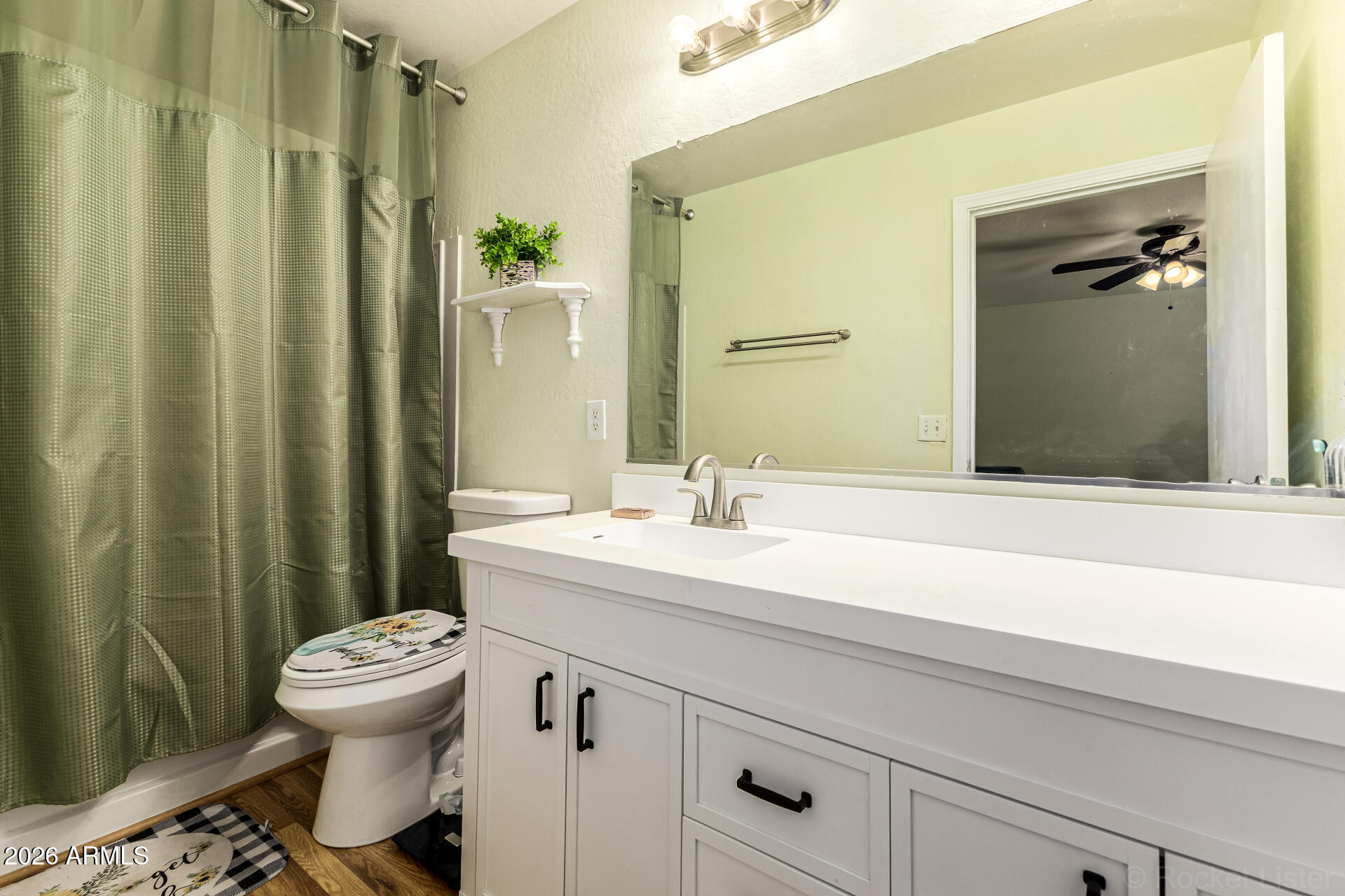 40264 West Lococo Street Maricopa, AZ 85138 - Photo 19 of 29 a bathroom with a sink a toilet and shower