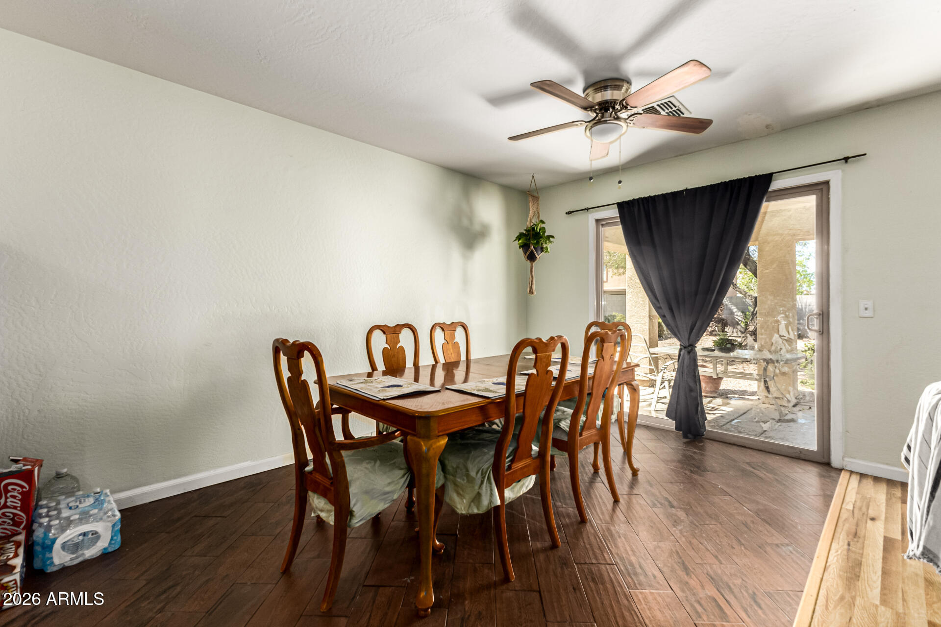 40264 West Lococo Street Maricopa, AZ 85138 - Photo 27 of 29 a view of a dining room with furniture and wooden floor
