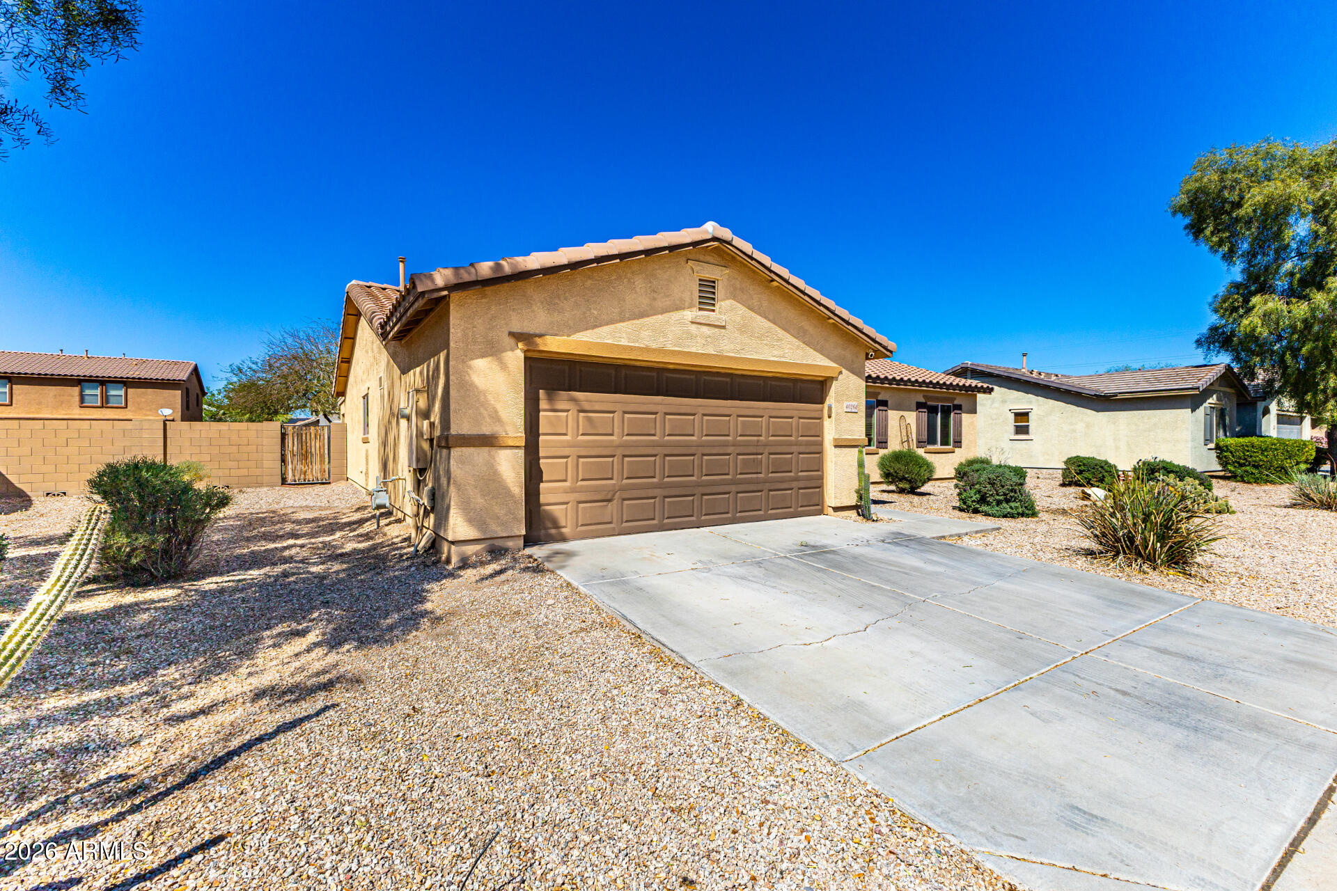 40264 West Lococo Street Maricopa, AZ 85138 - Photo 4 of 29 a front view of a house with a yard