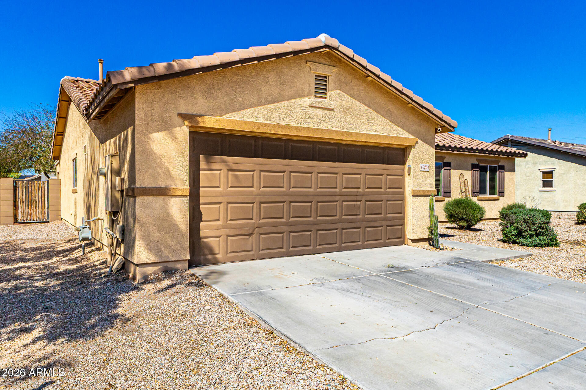 40264 West Lococo Street Maricopa, AZ 85138 - Photo 5 of 29 a front view of a house with a yard