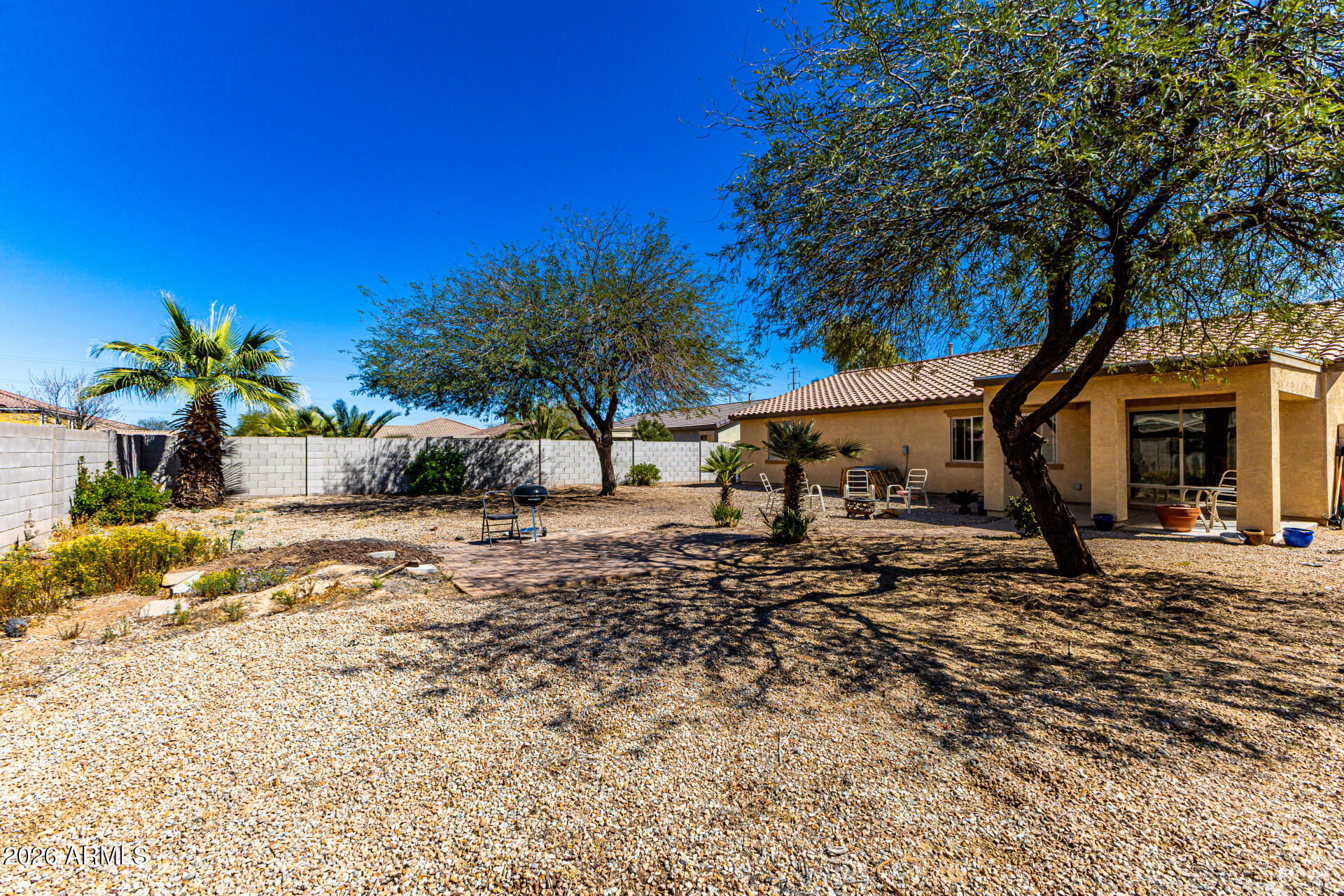40264 West Lococo Street Maricopa, AZ 85138 - Photo 6 of 29 a view of a house with a tree in the background