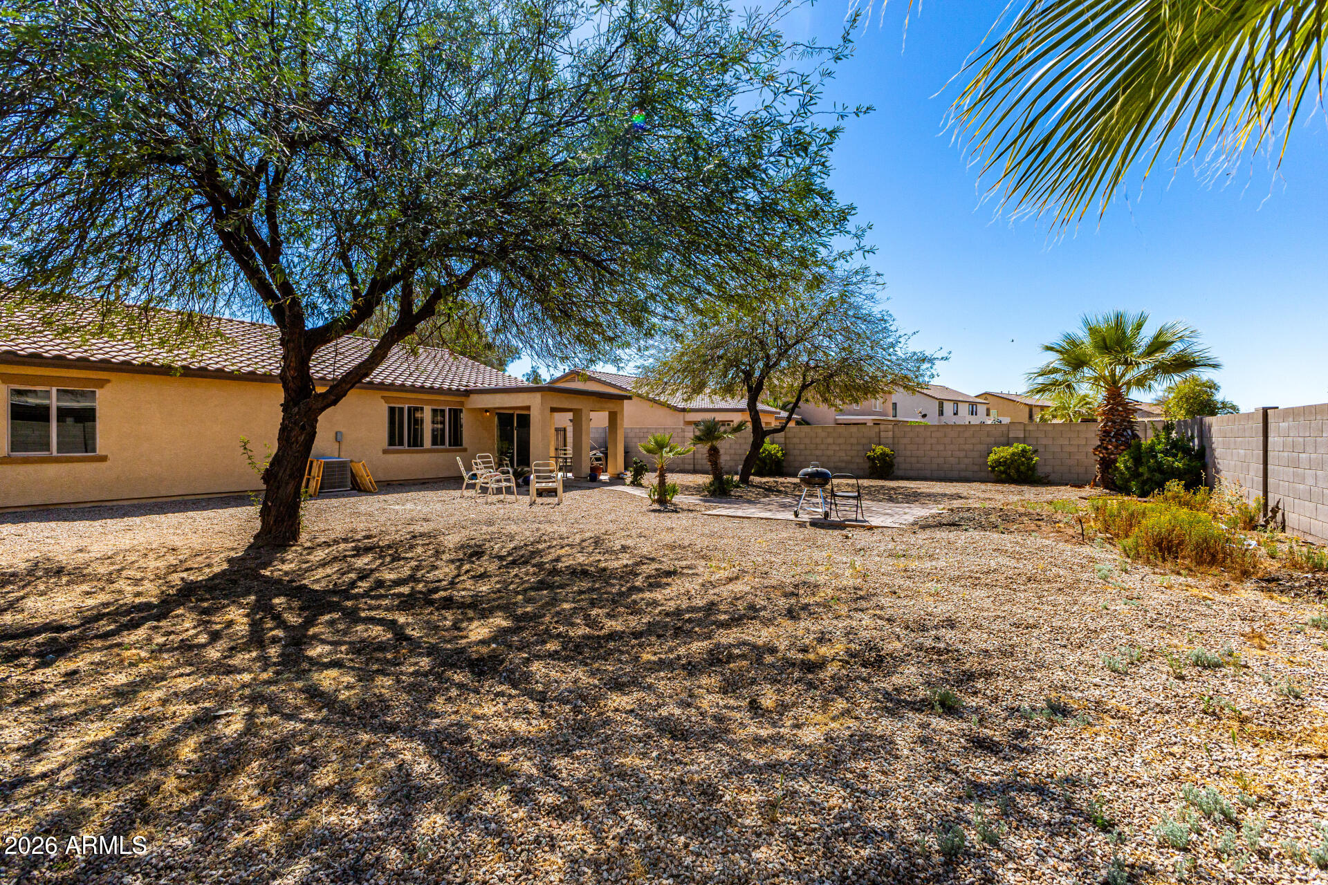 40264 West Lococo Street Maricopa, AZ 85138 - Photo 7 of 29 a front view of a house with a yard