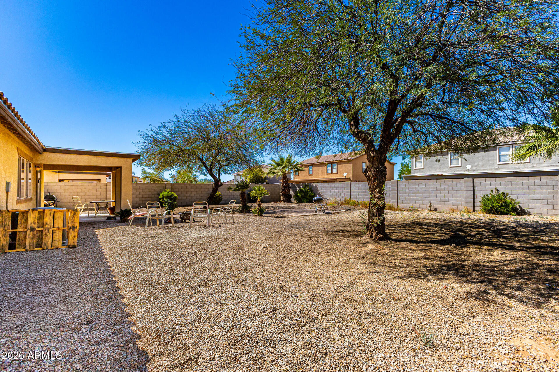 40264 West Lococo Street Maricopa, AZ 85138 - Photo 8 of 29 a view of a house with a yard