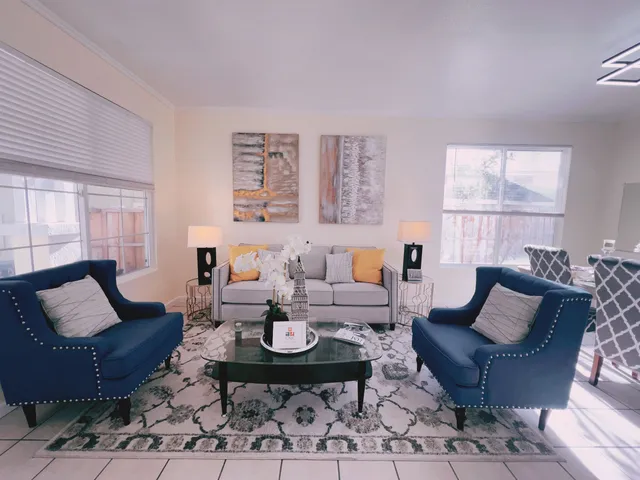a living room with furniture and a window