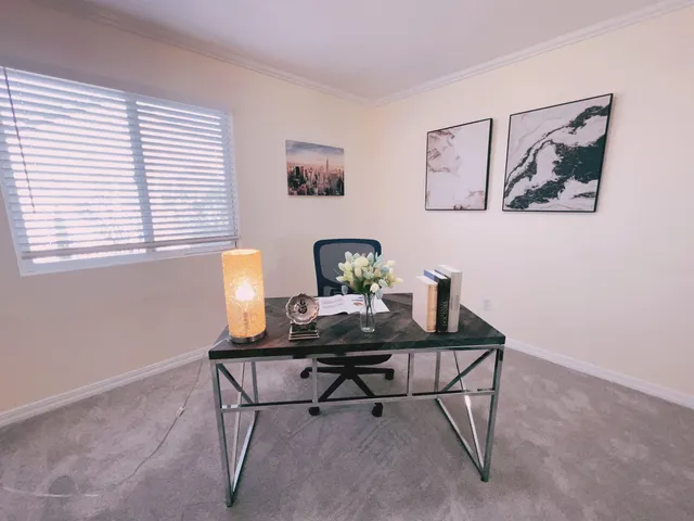 a workspace with furniture and a window