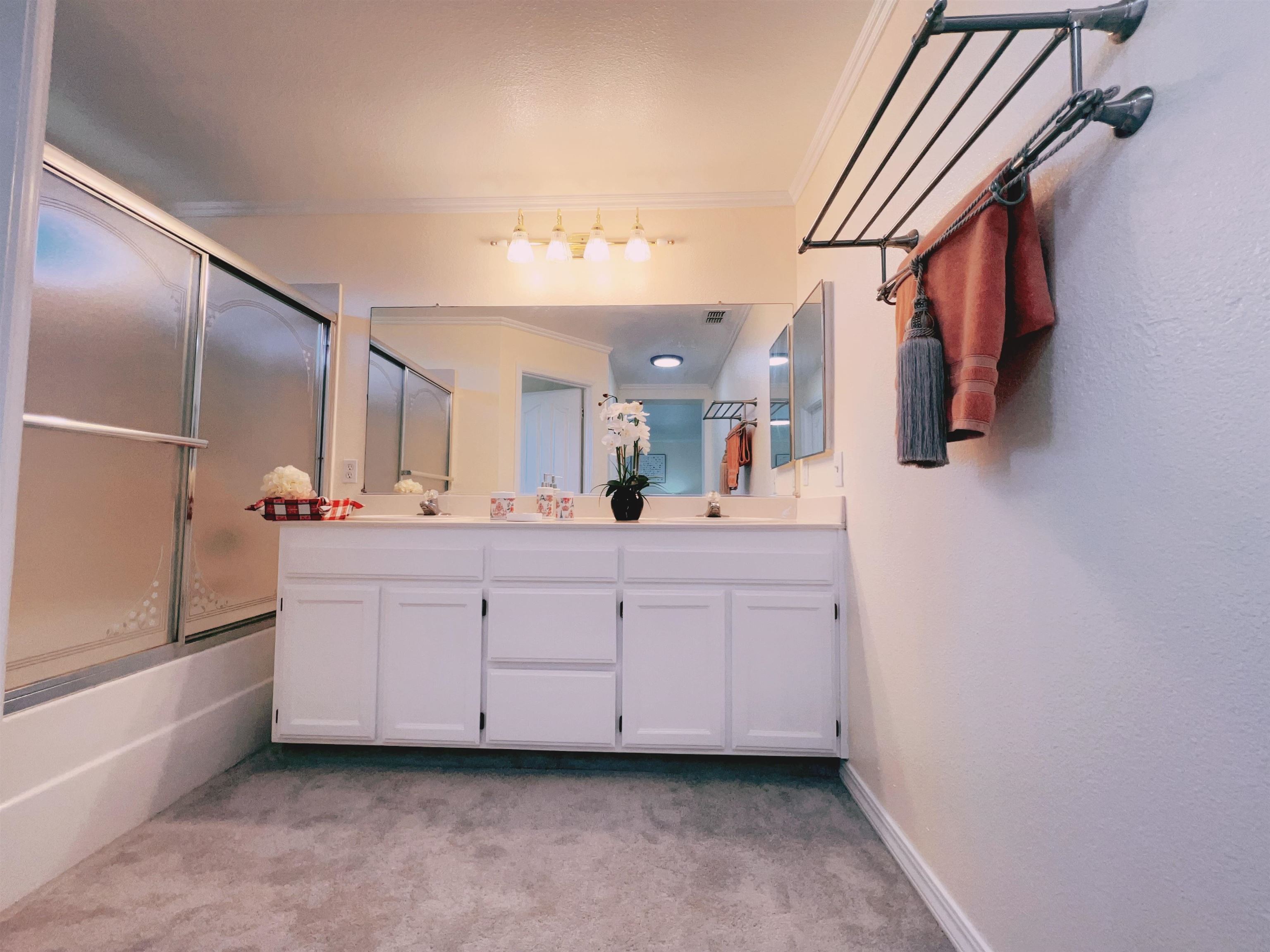 19 Quartz Court Pittsburg, CA 94565 - Photo 21 of 27 a bathroom with a sink a mirror and a bathtub