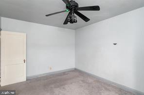 1618 Roundhill Road Baltimore, MD 21218 - Photo 27 of 50 a view of a chandelier fan in a room