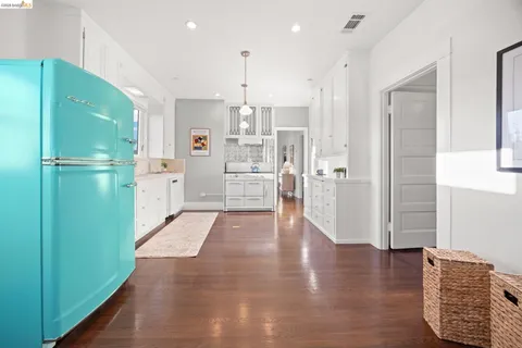a kitchen with stainless steel appliances granite countertop a stove and a refrigerator