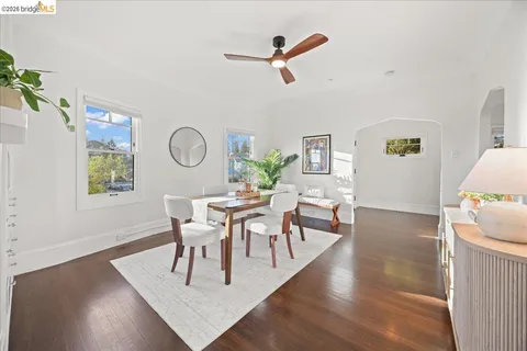 a view of a dining room with furniture and a window