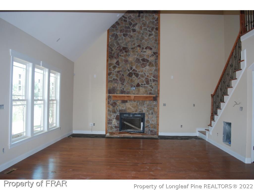 270 Falling Water Road Spring Lake, NC 28390 - Photo 12 of 34 a view of an empty room with wooden floor and a window