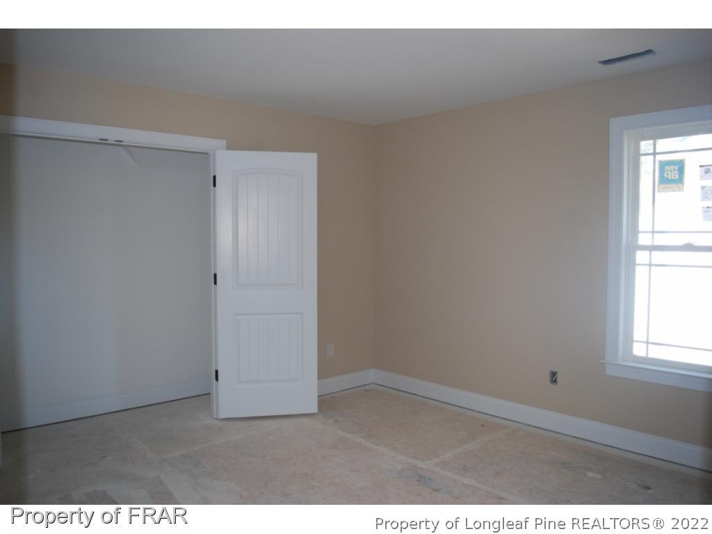 270 Falling Water Road Spring Lake, NC 28390 - Photo 20 of 34 an empty room with windows