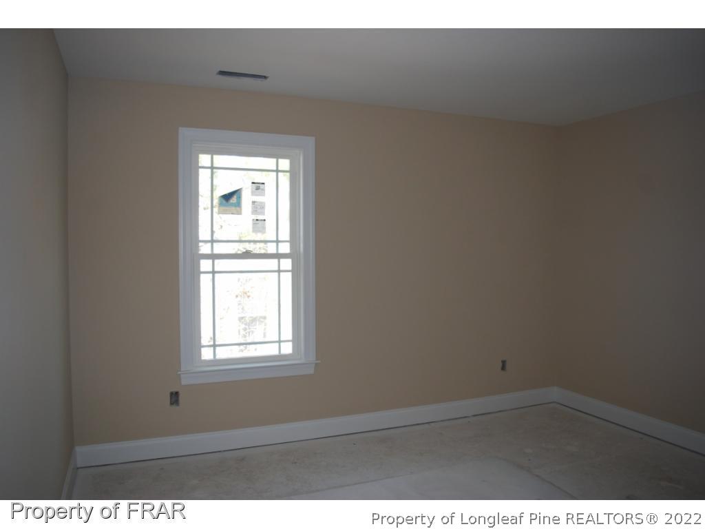 270 Falling Water Road Spring Lake, NC 28390 - Photo 21 of 34 a view of an empty room with a window