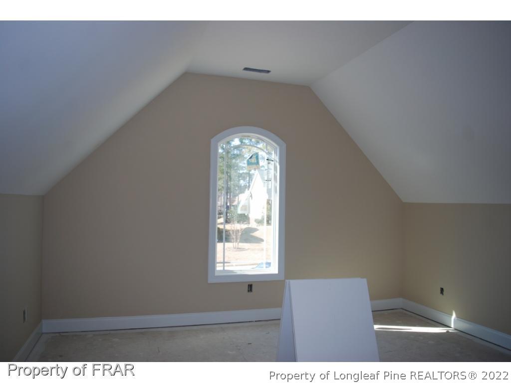 270 Falling Water Road Spring Lake, NC 28390 - Photo 23 of 34 a view of an empty room with wooden floor