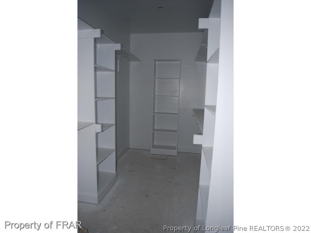 270 Falling Water Road Spring Lake, NC 28390 - Photo 26 of 34 a view of walk in closet with cabinet