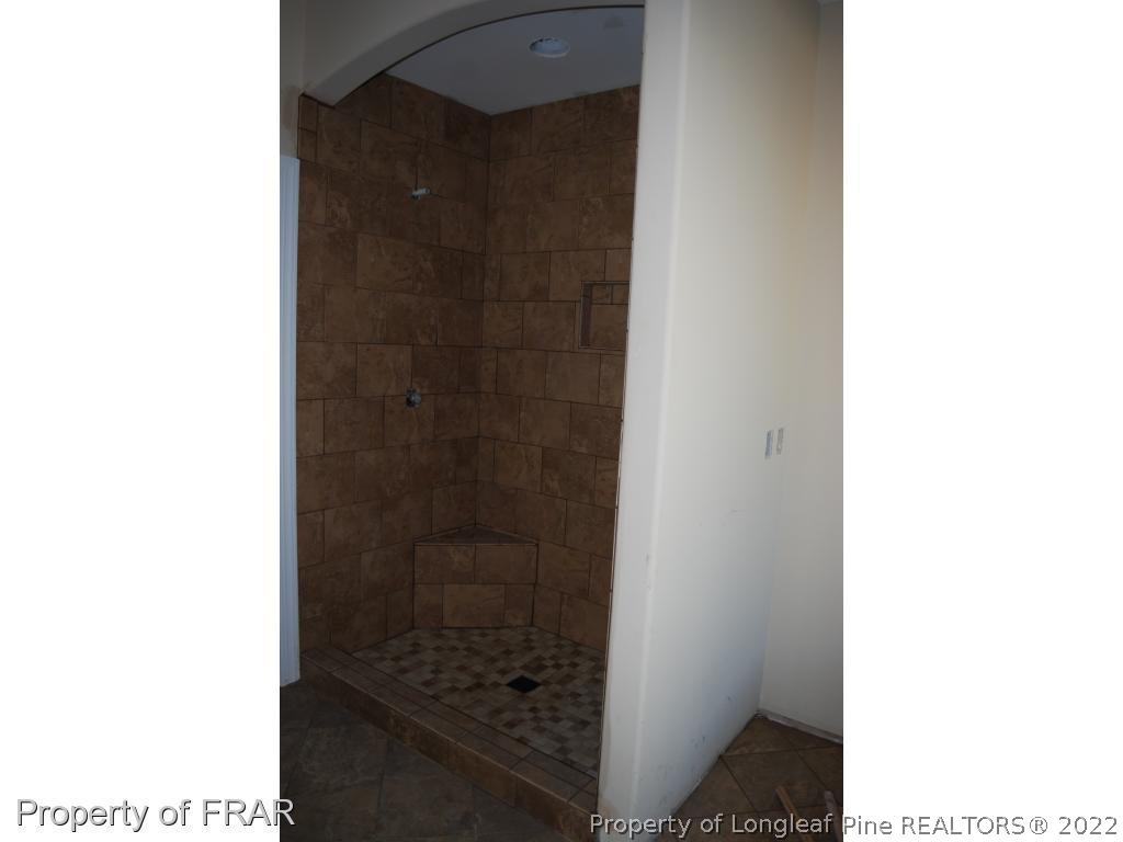 270 Falling Water Road Spring Lake, NC 28390 - Photo 28 of 34 a bathroom with a shower and a sink