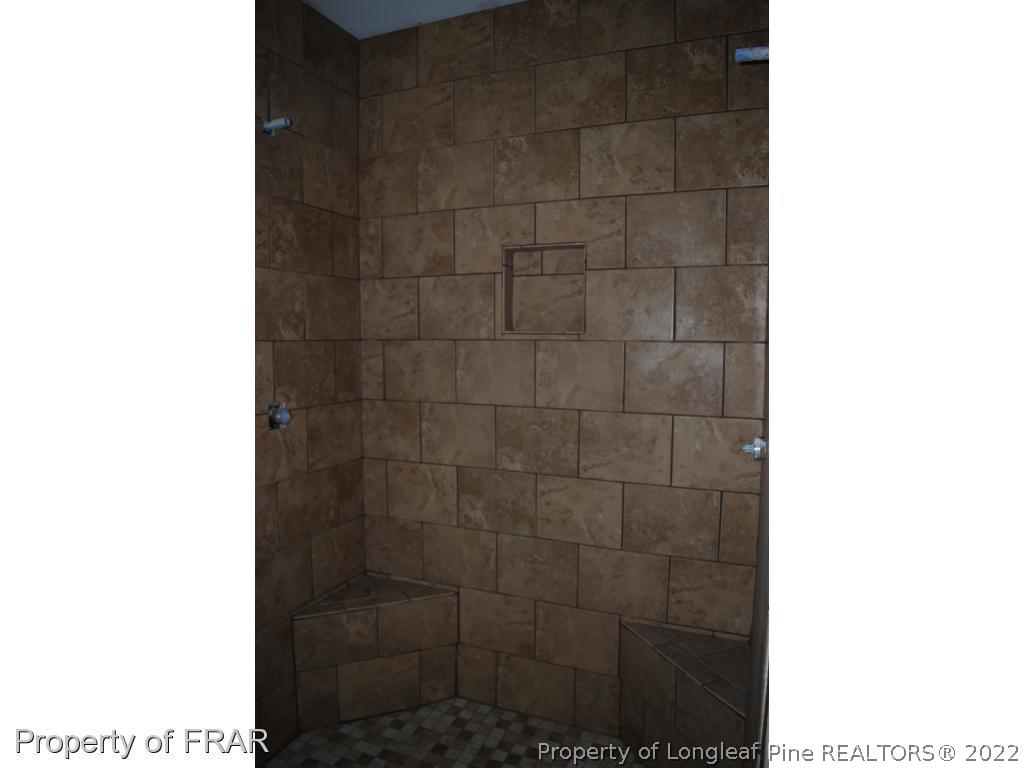 270 Falling Water Road Spring Lake, NC 28390 - Photo 29 of 34 a bathroom with a shower