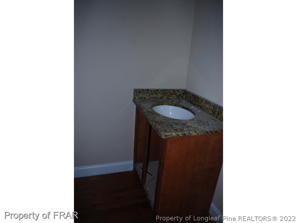 270 Falling Water Road Spring Lake, NC 28390 - Photo 32 of 34 a picture of a bathroom with a sink and a shower