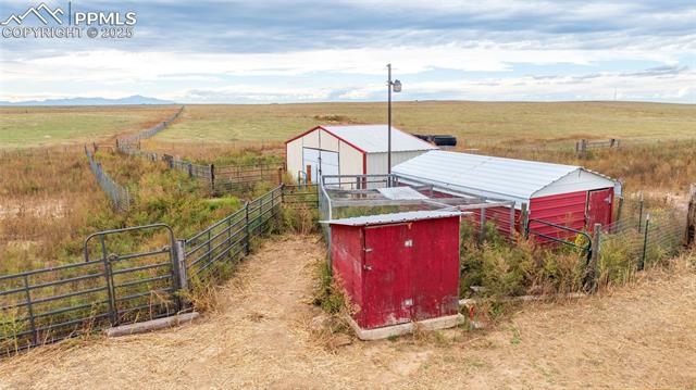 7940 Edison Road Yoder, CO 80864 - Photo 38 of 38 View of shed with a view of rural / pastoral area and a gate