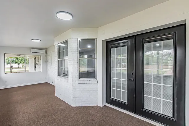 a view of yard with tree in the background