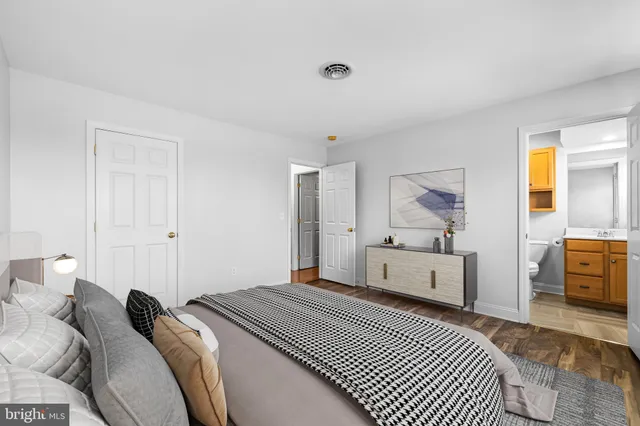 a bedroom with a large bed and a couch