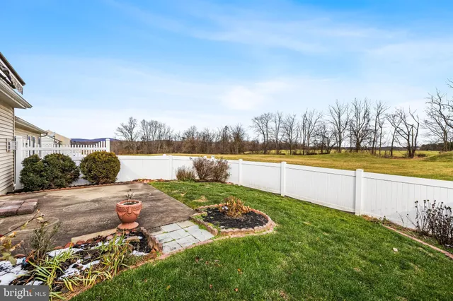 a view of a lake with houses in the back