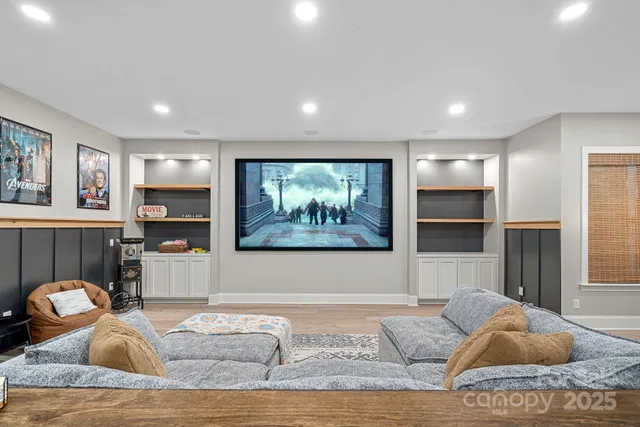 a living room with furniture and kitchen view