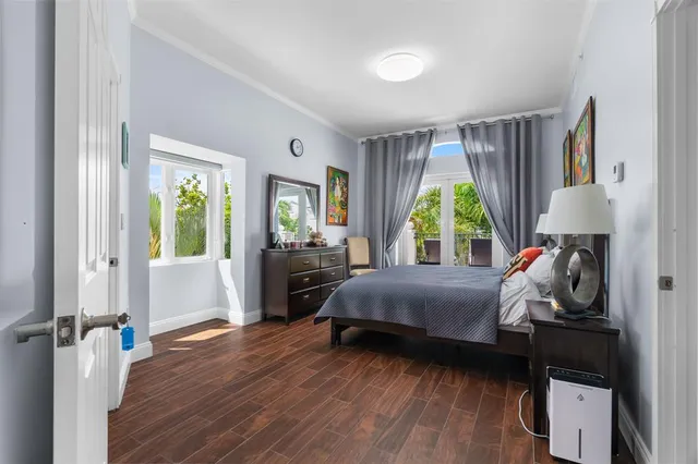 a bedroom with a bed and a chair in it